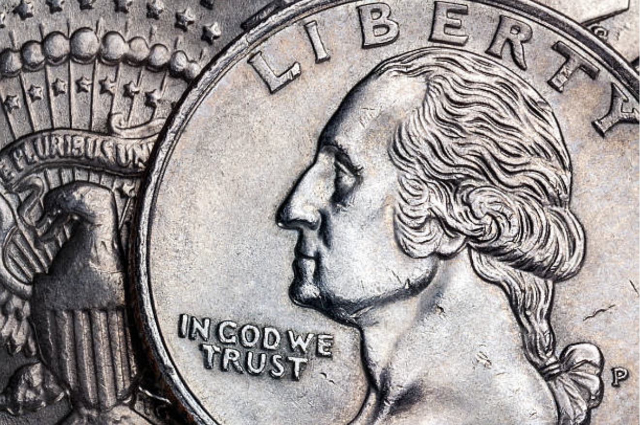 Two quarters inscribed with the national motto of the United States